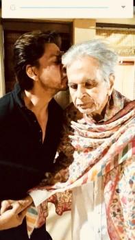Superstar Shah Rukh Khan has visited Bollywood legend Dilip Kumar at his residence here. This was his second visit in six months. On Monday, Faisal Farooqui, a family friend of Dilip Kumar, took to the veteran actor's official Twitter account to share a photograph of Shah Rukh and the 95-year-old.  Shah Rukh is dressed in black, while a shawl is wrapped around a frail Dilip Kumar.