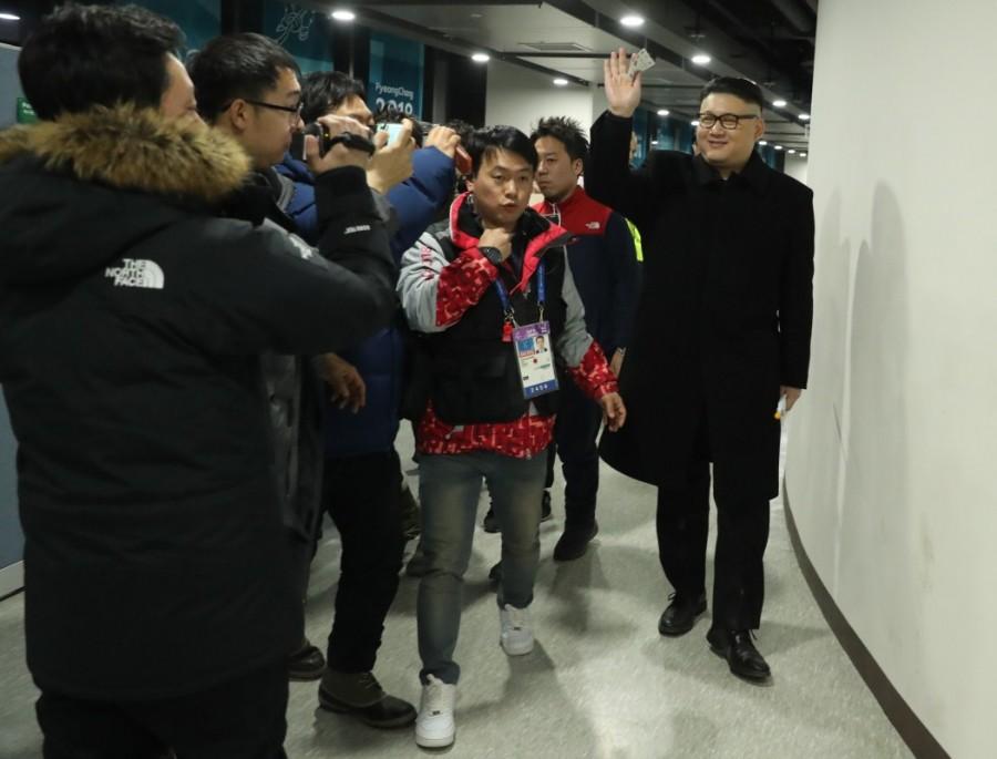 A man impersonating Kim Jong Un is escorted from the arena by security personnel. Kim Jong Un,Kim Jong Un lookalike,Celebs lookalike,2018 Winter Olympics,Kim Jong Un lookalike pics,Kim Jong Un lookalike images,Korean hockey team