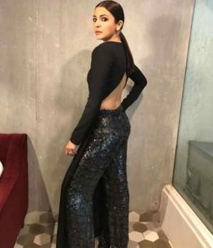 Anushka Sharma sizzles in black slit top and shimmer pants.