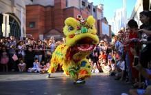 Performers dressed in costumes dance for spectators as part of celebrations for the Chinese Lunar New Year and marking the Year of the Dog in Sydney, Australia.