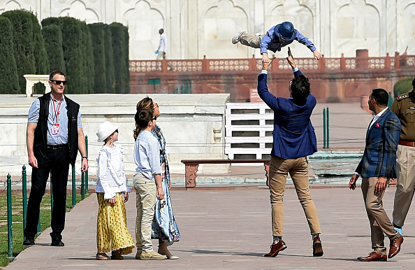 Prime Minister of Canada Justin Trudeau (2R) plays with his son Hadrien while his wife Sophie Gregoire Trudeau and their other two children look on during their visit to the Taj Mahal in Agra on February 18, 2018. Trudeau and his family arrived at the Taj Mahal on February 18, kickstarting their week-long trip to India aimed at boosting economic ties between the two countries. Sophie Gregoire,Justin Trudeau,Ella-Grace,Justin Trudeau in Taj Mahal,Canadian Prime Minister