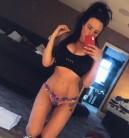 Busty Charlotte Crosby flaunts her ample cleavage and gym-honed abs in a sports bra.