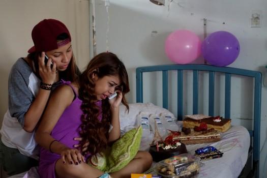 Lismar Castellanos, 21, who lost her transplanted kidney, cries while she speaks on the phone with a relative during her birthday celebration at a state hospital in Caracas, Venezuela.
