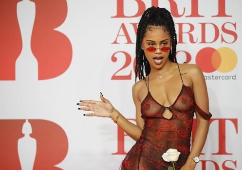 Diana De Brito, known as IAMDDB poses on the red carpet on arrival for the BRIT Awards 2018.