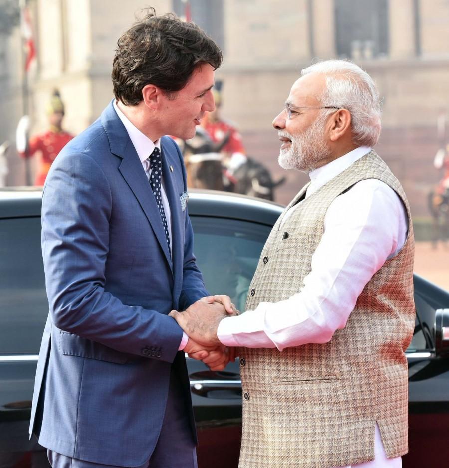 After Trudeau, his wife Sophie, and children Xavier, Ella-Grace and Hadrien, alighted from a car on the forecourt of the Rashtrapati Bhavan. Modi shook hands with Trudeau and then hugged him. Narendra Modi,PM Narendra Modi,Justin Trudeau,Canadian Prime Minister Justin Trudeau,Justin Trudeau with Modi