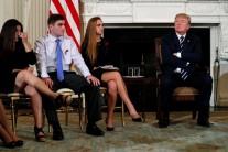 Parent Melissa Blank (L) and Marjory Stoneman Douglas High School shooting surviving students Jonathan Blank (2nd L) and Julia Cordover (2nd R) attend with other survivors and the families of victims a listening session held by President Donald Trump to discuss school safety and shootings, at the White House in Washington, February 21, 2018.