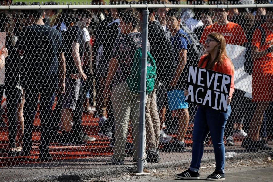 Students from Western High School carrying placards, take part in a protest in support of the gun control, following a mass shooting at Marjory Stoneman Douglas High School, in Davie, Florida, February 21, 2018. Florida shooting survivors,Donald Trump,US President Donald Trump,Marjory Stoneman Douglas High School,gun control push