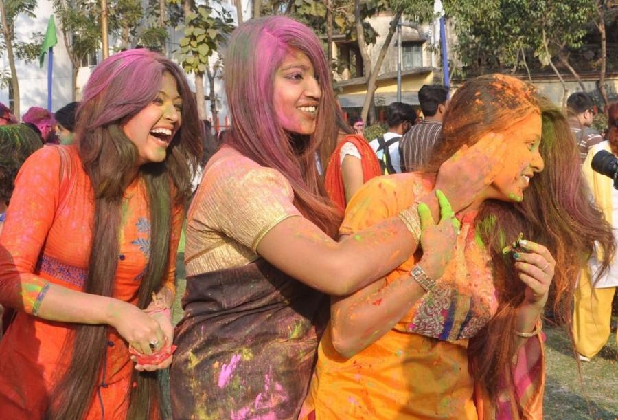 Students enjoys during Holi celebrations at Basanta Utsav at Rabindra Bharati University in Kolkata Holi,Holi celebration,holi celebration in india,holi celebration photos,Holi celebration pics,Basanta Utsav,Basanta Utsav celebrations