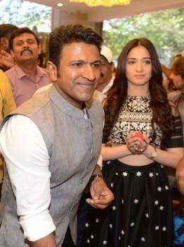 Puneeth Rajkumar, Tamannaah inaugurates Pothys showroom in Bengaluru on Feb 26, 2018.