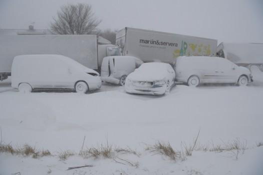 Several trucks and cars stand deserted after a pileup near Sjobo, Sweden.