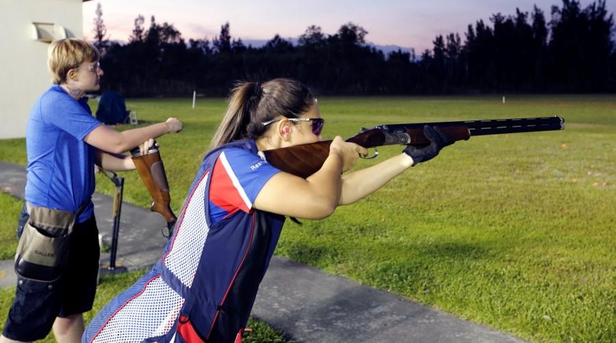 Reanna Frauens (L), 16, takes her turn during a clay target youth group shooting meeting. Florida youth shooting club,Florida youth,youth shooting club,Marjory Stoneman Douglas High School
