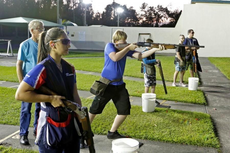 Reanna Frauens (L), 16, waits for her turn during a clay target youth group shooting meeting. Florida youth shooting club,Florida youth,youth shooting club,Marjory Stoneman Douglas High School