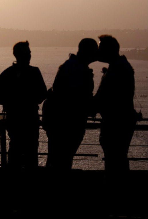 Warren Orlandi and Pauly Phillips kiss after they became the first same-sex couple to marry atop of the Sydney Harbour Bridge, just two days out from the 40th anniversary of the Sydney Gay and Lesbian Mardi Gras, in Australia, March 1, 2018. Sydney Harbour Bridge,Warren Orlandi and Pauly Phillips,Warren Orlandi,Pauly Phillips,same sex wedding