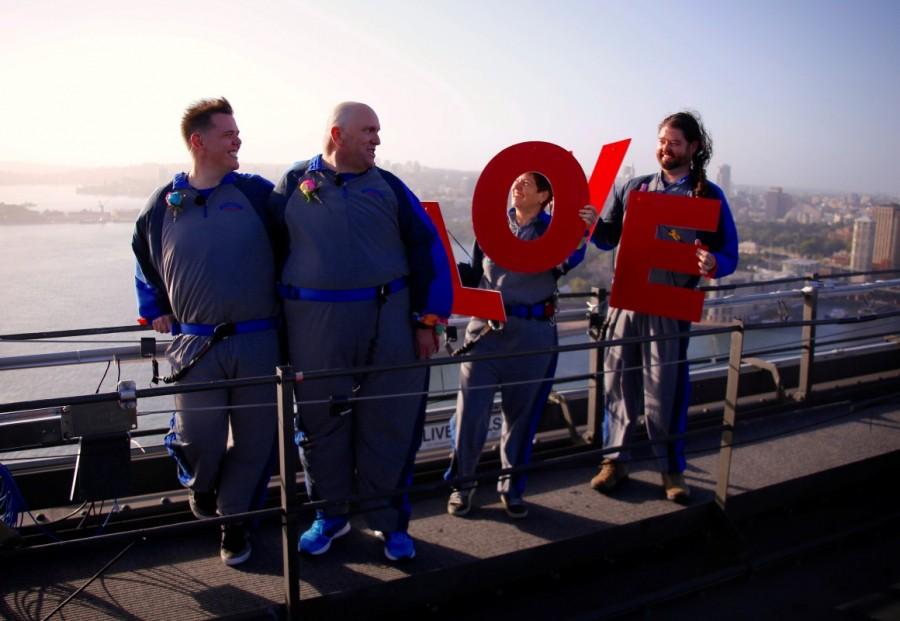 Warren Orlandi and Pauly Phillips celebrate with friends after they became the first same-sex couple to marry atop of the Sydney Harbour Bridge, just two days out from the 40th anniversary of the Sydney Gay and Lesbian Mardi Gras, in Australia, March 1, 2018. Sydney Harbour Bridge,Warren Orlandi and Pauly Phillips,Warren Orlandi,Pauly Phillips,same sex wedding
