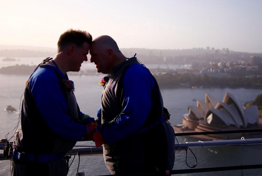 Warren Orlandi and Pauly Phillips react after they became the first same-sex couple to marry atop of the Sydney Harbour Bridge, just two days out from the 40th anniversary of the Sydney Gay and Lesbian Mardi Gras, in Australia, March 1, 2018. Sydney Harbour Bridge,Warren Orlandi and Pauly Phillips,Warren Orlandi,Pauly Phillips,same sex wedding