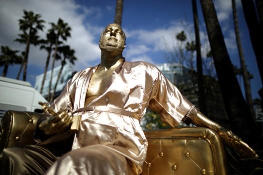 A statue of Harvey Weinstein on a casting couch made by artist Plastic Jesus is seen on Hollywood Boulevard near the Dolby Theatre during preparations for the Oscars in Hollywood, Los Angeles, California, U.S.