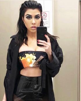 Kourtney Kardashian shares bathroom selfie in Tiny crop top.