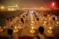 Thousands of believers join Buddhist monks praying at the Wat Phra Dhammakaya temple during a ceremony on Makha Bucha Day in Pathum Thani, Thailand.