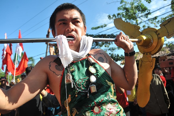 This photo taken on March 2, 2018 shows participants taking part in the Cap Go Meh Festival, also known as Yuanxiao festival in China, which marks the 15th and final day of the Lunar New Year celebrations in Singkawang, Indonesia's West Kalimantan. Taiwan celebrates Chinese New Year,Chinese New Year,Chinese New Year celebration,Chinese New Year 2018,Lantern Festival 2018