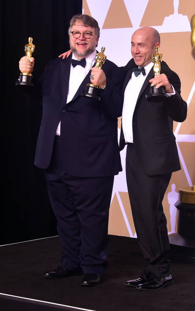 Producer and director Guillermo del Toro (L) and producter J. Miles Dale pose in the press room with the Oscar for best picture and best director for their film The Shape of Water during the 90th Annual Academy Awards on March 4, 2018, in Hollywood, California. Guillermo del Toro,Frances McDormand,Gary Oldman,Kristen Anderson-Lopez,Robert Lopez,Sam Rockwell,Frances McDormand,Allison Janney,Oscars 2018,Oscars 2018 winners,Oscars winners