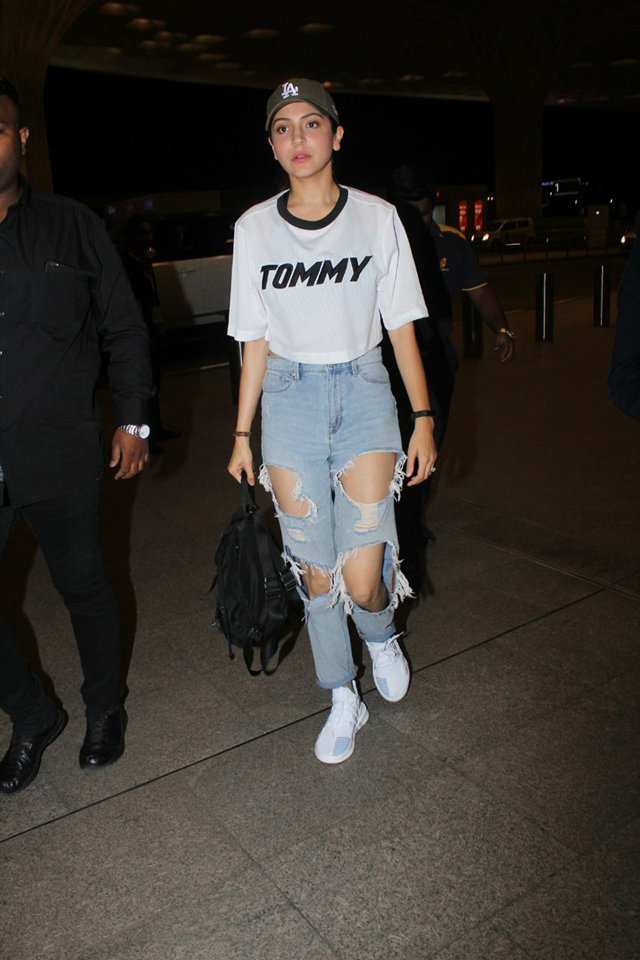 Anushka Sharma was photographed navigating the Mumbai airport on Tuesday. Anushka Sharma,Anushka Sharma Ripped jeans,Anushka Sharma at Mumbai Airport,Anushka Sharma at Airport,Anushka Sharma new look,Anushka Sharma fashion,Anushka Sharma pics,Anushka Sharma images,Anushka Sharma poster,Anushka Sharma wallpaper