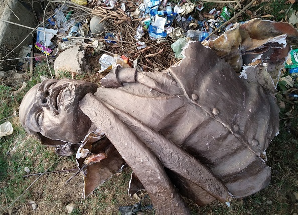 Lenin statue is seen laying on the ground after Indian supporters of Bharatiya Mazdoor Sangh, a wing of Bharatiya Janata Party, toppled the statue in Belonia, some 76 kms south of Agartala, the capital of northeastern Indian state of Tripura. Lenin statue,Lenin,Tripura Lenin statue brought down,Lenin statue demolished,Tripura,Bharatiya Janata Party,BPJ