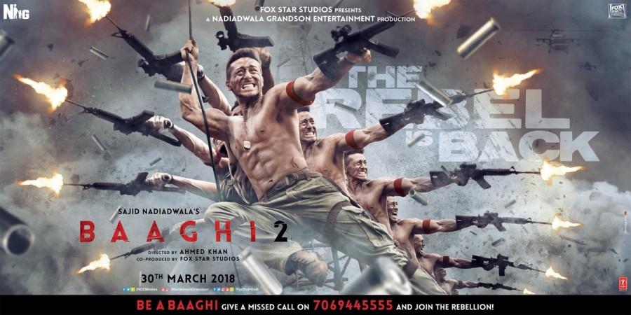 Ronnie aka Tiger Shroff goes all guns blazing in this new poster of Baaghi 2. Tiger Shroff,Tiger Shroff Baaghi 2,Baaghi 2,Baaghi 2 first look poster,Baaghi 2 first look,Baaghi 2 poster,Baaghi 2 movie poster,Baaghi 2 movie pics,Baaghi 2 movie images,Baaghi 2 movie stills,Baaghi 2 movie pictures,Baaghi 2 movie photos