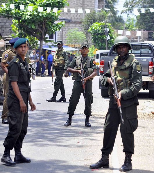 Sri Lankan police patrol on the streets of Pallekele, a suburb of Kandy, on March 6, 2018, following anti-Muslim riots that has prompted the government to declare a state of emergency. Sri Lanka,Buddhist-Muslim clashes,Buddhist-Muslim fight,Buddhist-Muslim clashes in Sri Lanka,Sri Lanka nationwide state emergency,Sri Lanka emergency