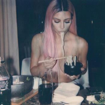 Reality TV personality Kim Kardashian has shared a photograph in which she is seen eating ramen while she is topless. In the image, Kim, 37, is seen topless while eating. Her hands and freshly-dyed pink hair were positioned to partially cover her breasts.