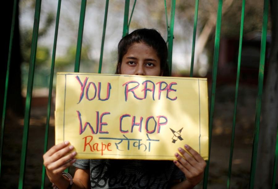 A girl holds a placard as she takes part in a movement against rapes on the occasion of International Women’s Day in New Delhi, India, March 8, 2018. International Women's Day 2018,International Women's Day 2018 celebration,Women's day celebration,Women's day celebration pics,Women's day celebration images