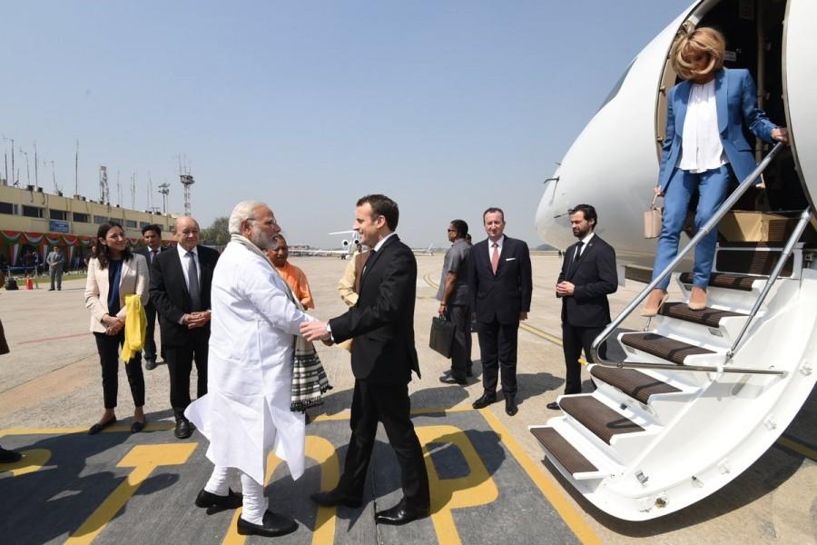 Modi arrived at the airport in a special Indian Air Force (IAF) plane minutes ahead of the visiting foreign dignitary. Narendra Modi,Prime Minister Narendra Modi,French President Emmanuel Macron,Emmanuel Macron,Modi receives Emmanuel Macron