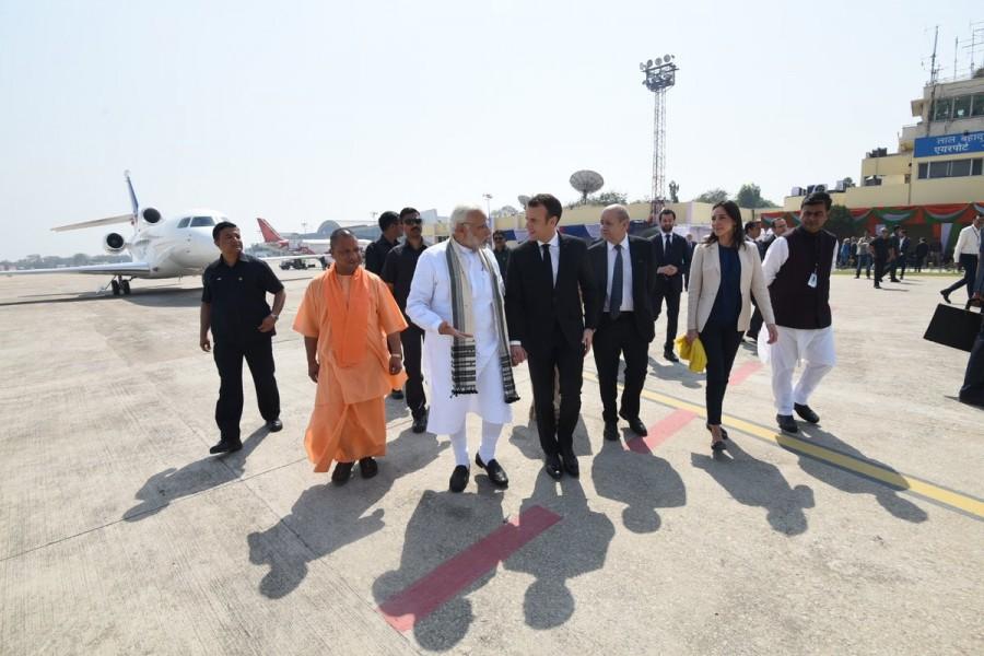 Flanked by Uttar Pradesh Governor Ram Naik, Chief Minister Yogi Adityanath, public representatives and state government officials, Modi accorded a warm welcome to Macron as he alighted from his special Falcon aircraft at the Lal Bahadur Shastri International Airport here. Narendra Modi,Prime Minister Narendra Modi,French President Emmanuel Macron,Emmanuel Macron,Modi receives Emmanuel Macron