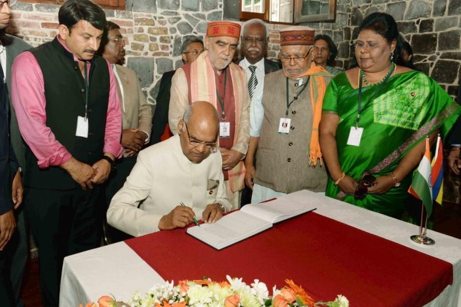 President Ram Nath Kovind signs the visitor's book of Aapravasi Ghat World Heritage Site in Port Louis, Mauritius on March 12, 2018. President Ram Nath Kovind,Ram Nath Kovind,Ram Nath Kovind visits Aapravasi Ghat,Aapravasi Ghat World Heritage Site,Port Louis
