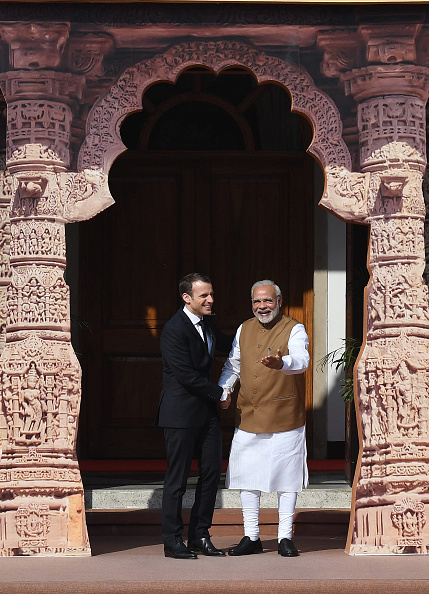 Indian Prime Minister Narendra Modi (R) welcomes French President Emmanuel Macron to the founding conference of the International Solar Alliance in New Delhi on March 11, 2018. French President Emmanuel Macron,Emmanuel Macron,Emmanuel Macron in India,Emmanuel Macron best moments,Emmanuel Macron best moments in India