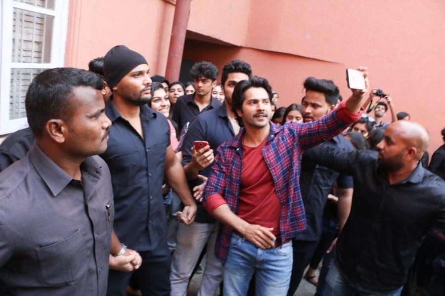 Actor Varun Dhawan is seen taking a selfie with fans during October movie promotion at Sophia College in Mumbai. Varun Dhawan and Banita Sandhu,Varun Dhawan,Banita Sandhu,October,October promotion,October movie promotion,October promotion pics,October promotion images