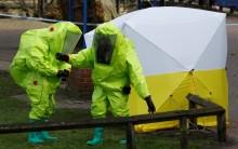 The forensic tent, covering the bench where Sergei Skripal and his daughter Yulia were found, is repositioned by officials in protective suits in the centre of Salisbury, Britain.