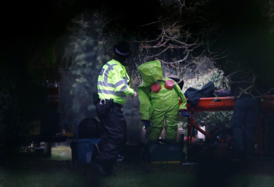 Members of the emergency services put on protective suits near to the grave of Luidmila Skripal, wife of former Russian intelligence agent Sergei Skripal, at the London Road Cemetery in Salisbury, Britain. Russian double agent,Russian agent,Sergei Skripal,Sergei Skripal and his daughter,former Russian double agent