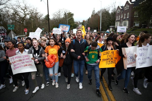 Roosevelt High School student organizers Scout Smissen, 17, and Gabe Rosenbloom march with Zach Heffron, 18, of Nathan Hale High School as they march with hundreds of other students to the University of Washington in Seattle, Washington. Florida school shooting,Marjory Stoneman Douglas High School shooting,National School Walkout,protest against gun violence,U.S. Students Protest Gun Violence
