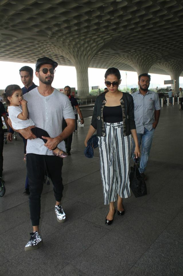 Mira Rajput dresses in a simple outfit with white and black-stripe pants paired with a basic black top with a grey jacket. Shahid Kapoor,Shahid Kapoor family,misha kapoor,Mira Rajput,Shahid Kapoor at airport,Shahid Kapoor family vacay,Shahid Kapoor and Mira Rajput,Shahid Kapoor pics,Shahid Kapoor images