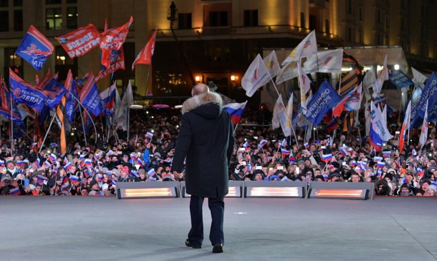 Russian President and Presidential candidate Vladimir Putin attends a rally and concert marking the fourth anniversary of Russia's annexation of the Crimea region, at Manezhnaya Square in central Moscow, Russia March 18, 2018. Vladimir Putin,Russian President Vladimir Putin,president vladimir putin,Vladimir Putin wins,Vladimir Putin re-election,Vladimir Putin pics,Vladimir Putin images