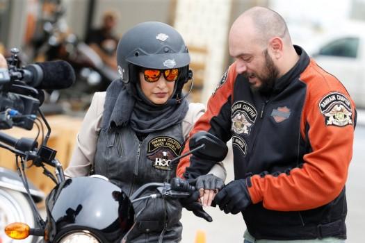Maryam Ahmed Al-Moalem, a Saudi female bike rider, is given the basics of operating a bike by trainer Rebal Mohammed, during her lessons in advanced motorcycle training at Harley Davidson training centre in Manama, Bahrain, March 16, 2018.