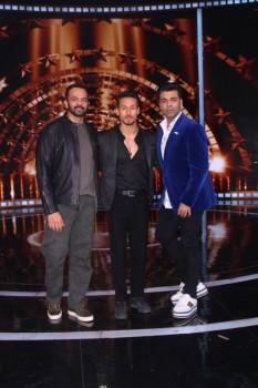 Actor Tiger Shroff with filmmakers Rohit Shetty and Karan Johar at Filmistan Studio in Mumbai.