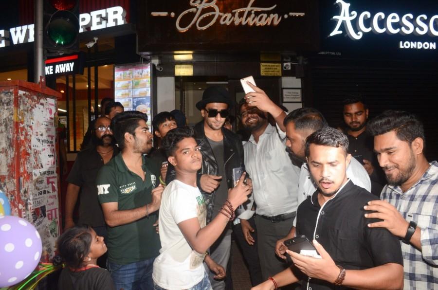 Actor Ranveer Singh is seen taking a selfie with fans at Bastian Restaurant, Bandra. Ranveer Singh,Ameesha Patel,Malaika Arora,Ranveer Singh in Bandra,Ameesha Patel in Bandra,Malaika Arora in Bandra,Ranveer Singh new pics,Ranveer Singh new images,Ameesha Patel new pics,Ameesha Patel images