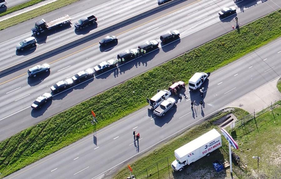 Law enforcement and fire personnel attend the scene where a serial bombing suspect died at the side of the highway near Round Rock, north of Austin, Texas, March 21, 2018, Austin,Texas bombing spree