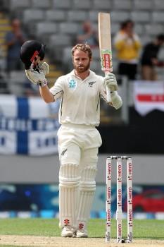 New Zealand's captain Kane Williamson celebrates his century during the second day of the day-night Test cricket match between New Zealand and England at Eden Park in Auckland on March 23, 2018.