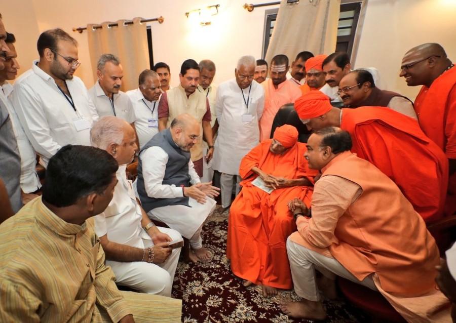 BJP President Amit Shah took his Twitter page and shared a picture with a caption: "Today I had the good fortune to seek blessings from the 'Walking God' Sri Sri Sri Shivakumara Swamiji of Siddhaganga Mutt, Tumakuru. His tireless work even at his advanced age is inspiring. His life is a living lesson and guiding light for all of us." Amit Shah,BJP Amit Shah,BJP president,BJP president Amit Shah,Amit Shah in Karnataka,Amit Shah at Siddaganga Matha,Siddaganga Matha,Sri Sri Sri Shivakumara Swamiji