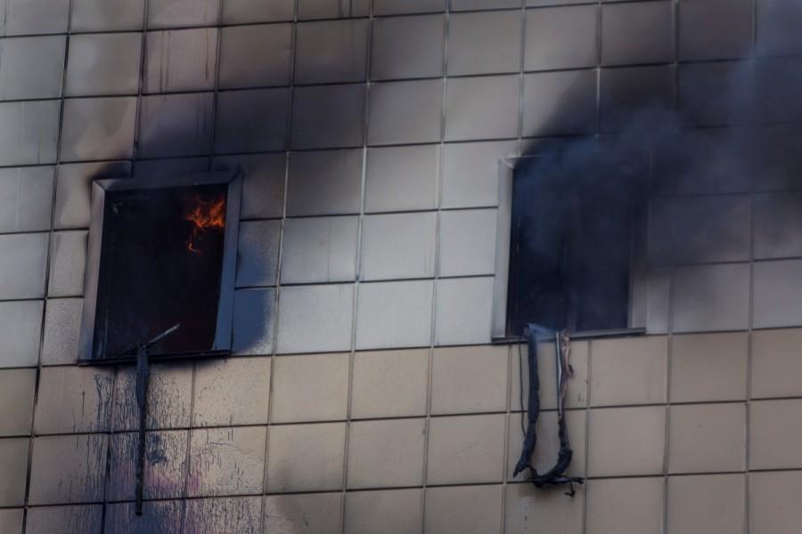 Smoke and flames engulf a shopping mall in the Siberian city of Kemerovo in the Siberian city of Kemerovo, Russia March 25, 2018. Picture taken March 25, 2018. Russian shopping mall,fire at Russian shopping mall,Soviet Union,deadliest fires,shopping mall fire