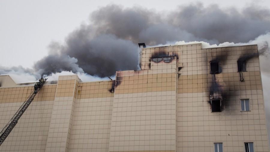 Members of the Emergency Situations Ministry work to extinguish a fire in a shopping mall in the Siberian city. Russian shopping mall,fire at Russian shopping mall,Soviet Union,deadliest fires,shopping mall fire
