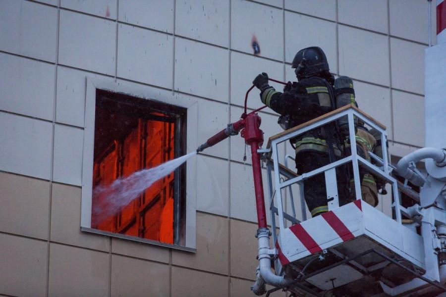 Members of the Emergency Situations Ministry work to extinguish a fire in a shopping mall in the Siberian city of Kemerovo, Russia March 25, 2018. Russian shopping mall,fire at Russian shopping mall,Soviet Union,deadliest fires,shopping mall fire