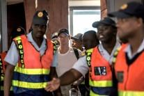 Former captain Steve Smith (C) of the Australian Cricket Team departs at O R Tambo International Airport after being caught cheating in the Sunfoil Test Series between Australia and South Africa, on March 28, 2018 in Johannesburg